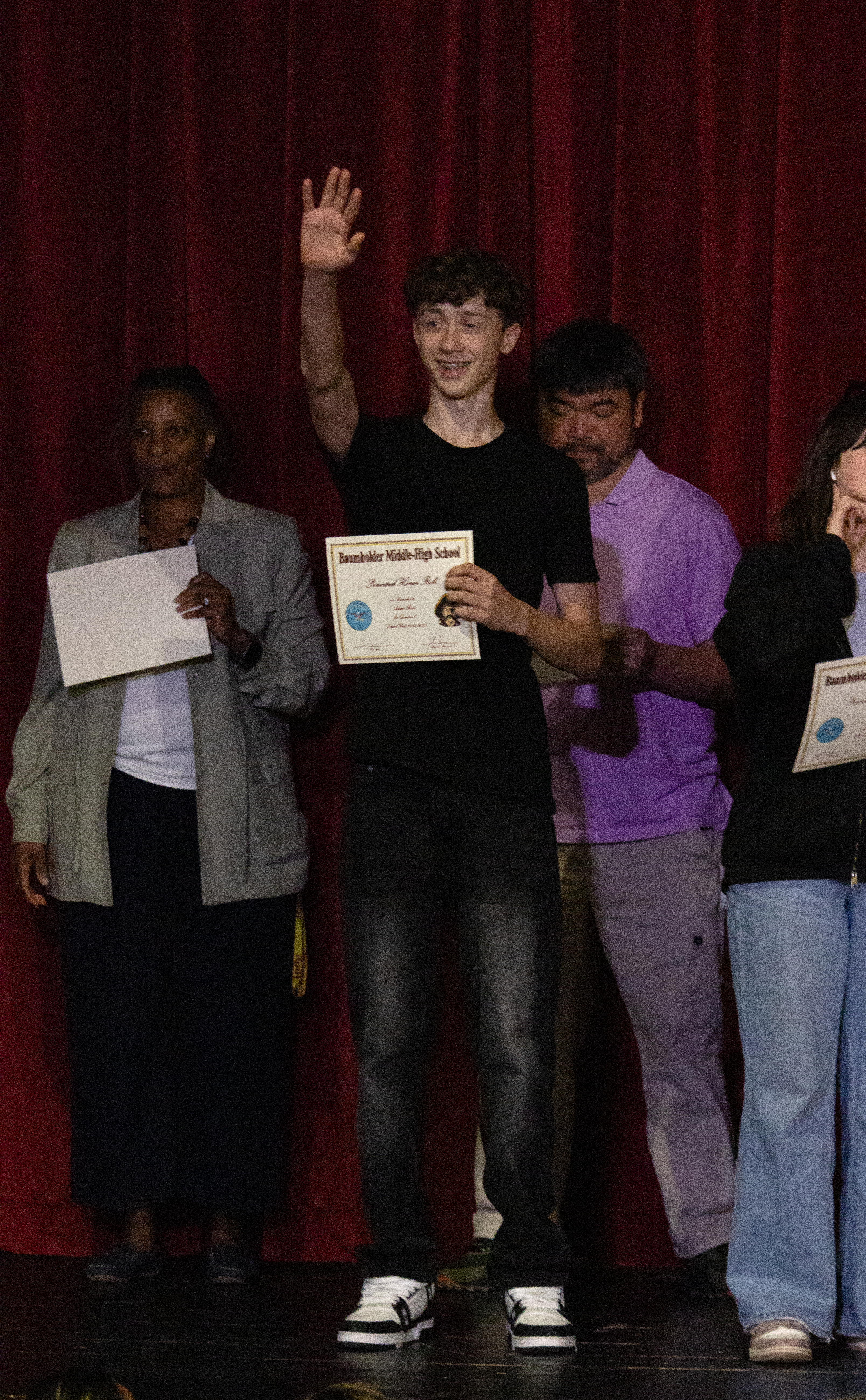 Adam Rosa waves to the crowd at the Honor Roll ceremony.